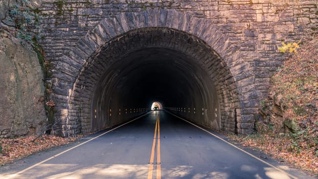 Car is driving through a tunnel on the Blue Ridge Parkway near Asheville, North Carolina