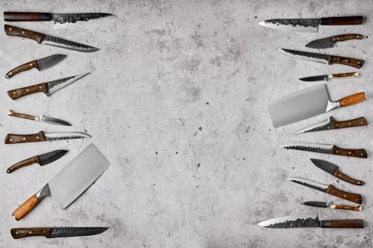 Overhead composition with different kinds of butcher's knives
