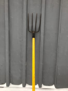 Garden pitchfork four-horned with a handle