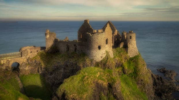 Front view of Dunluce Castle located on the edge of cliff, part of Wild Atlantic Way, Bushmills, Northern Ireland. Filming location of popular TV show