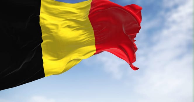 The national flag of Belgium waving on a clear day. Three equal vertical bands: black, yellow and red. 3d illustration render. European country. Rippled fabric.