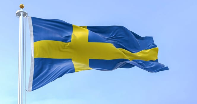 The national flag of Sweden waving on a clear day. Yellow Nordic cross on a blue background. Scandinavian country. 3d illustration render. Rippled fabric. Textured background