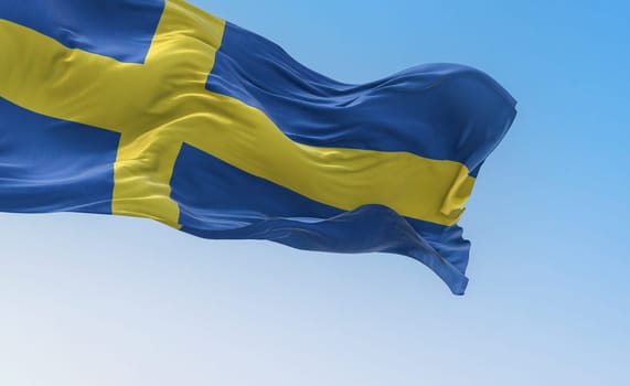 The national flag of Sweden waving on a clear day. Yellow Nordic cross on a blue background. Scandinavian country. 3d illustration render. Rippled fabric. Textured background