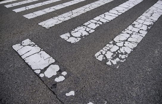 Detail of signal for pedestrians on the asphalt on a road