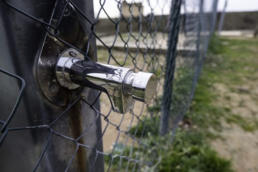 Detail of a drinking water source in the city, hydration