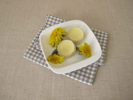 Homemade dandelion ointment, salve with an oil extract of dandelion flowers