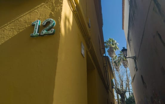 House number 12. Glazed decorated numbers. Houses with personality concept