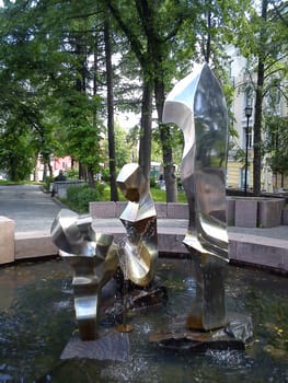 Petrozavodsk, Karelia, Russia, October 14, 2019 A fountain in the city square, depicting three figures - father, mother and child. The sculpture is made of metal