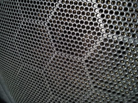 Gray grill from a music speaker in a car. The interior of the car. Acoustic stereo speakers. Speakers: speakers, players, radio in the form of toys or with a stylish design.