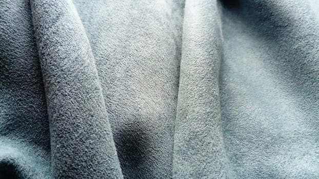 close-up of velvety thick fabric for curtains of gray-blue color