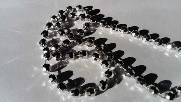 metal bracelet in the form of a thin thread of silver beads
