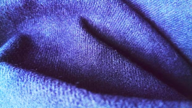 Dark blue fabric that looks like velvet or velveteen. Broken waves. Blue. Violet. The black