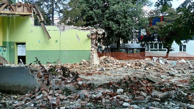 Sremska Mitrovica, Serbia, 13 August 2020. Dismantling and demolition of the old school named after Jovan Popovic. Holes in the walls and ceiling. Ruined classroom.