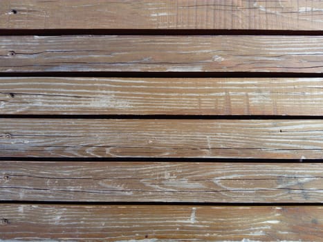 Beautiful smooth unpainted hammered boards. Wooden surface with cracks. A platform or staircase made of wood. Joiner's and carpentry product. The texture of natural material