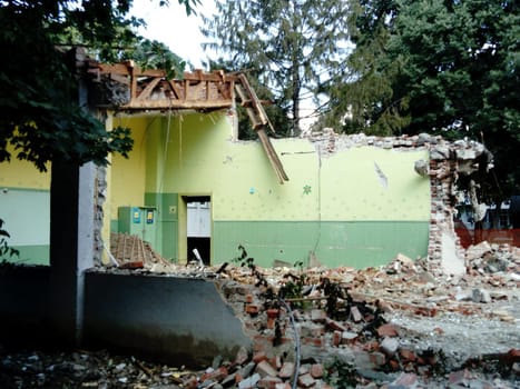Sremska Mitrovica, Serbia, 13 August 2020. Dismantling and demolition of the old school named after Jovan Popovic. Holes in the walls and ceiling. Ruined classroom.
