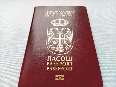Belgrade, Serbia, November 29, 2020. Serbian passport. New biometric document for border crossing. Official documentation. Shiny letters. Black and white monochrome photography