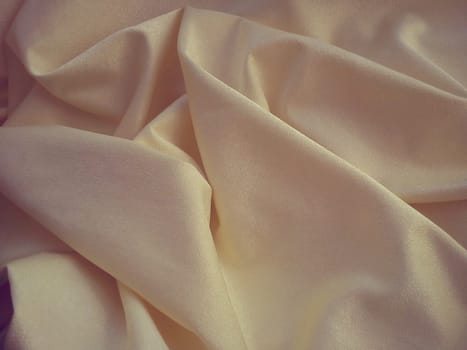 Beautiful velvet yellow-pink curtains. Light negligence when folding the material. Soft, soft-touch curtains for the room or kitchen. Fabric for sewing clothes.