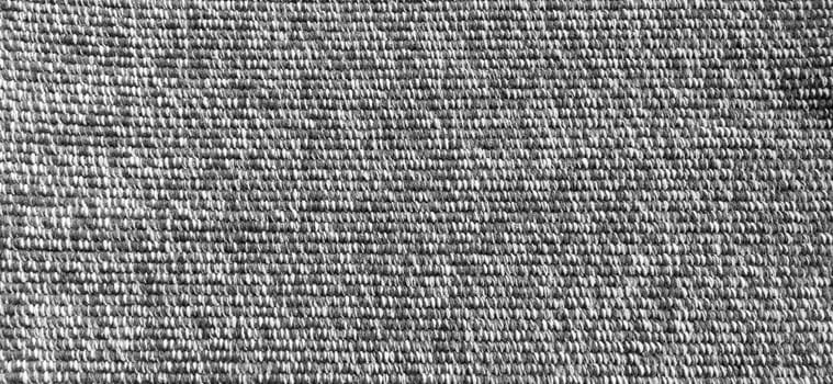 Woven coarse cotton fabric. Close-up. Black and white photography. Banner. Weaving thick threads. Smooth neat texture for the background