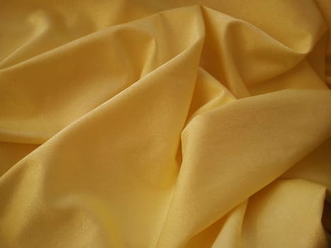 Beautiful velvet orange curtains. Light negligence when folding the material. Soft, soft-touch curtains for the room or kitchen. Fabric for sewing clothes.