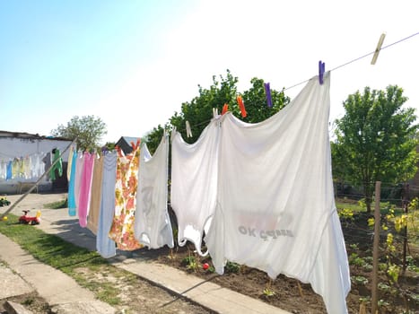 Sremska Mitrovica, Serbia July 10, 2020, towels and clothes dry on a rope. Housewife worries. The wet cloth is hung on clothespins for further drying. big washing.