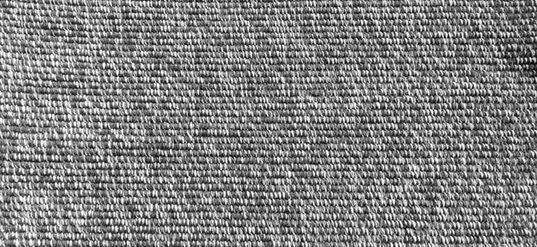 Woven coarse cotton fabric. Close-up. Black and white photography. Banner. Weaving thick threads. Smooth neat texture for the background