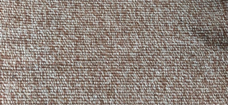 close up of fabric texture for background. Woven coarse cotton fabric with white, beige and brown threads. Banner