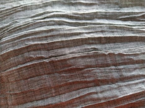 Fabric sheer curtain fabric. Beautiful gray color. The curtain material is carelessly folded and wrinkled. Fabric sample. Interior design option.