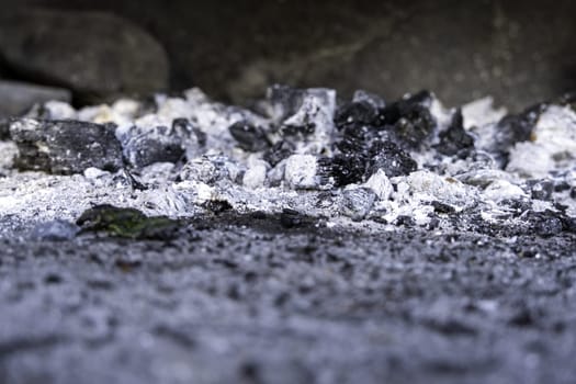 Detail of charcoal burned to grill food on a grill, party and celebration