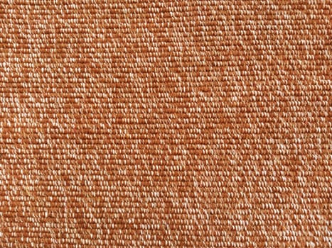 Wicker warm plaid close-up. The threads are brown, red and orange. Fabric or knit texture