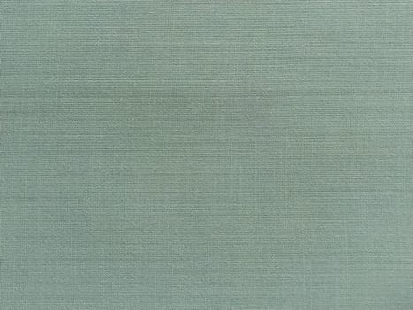 pale light green fabric. A piece of woolen fabric laid out neatly on the surface. Interlacing and textile texture. dress fabric or for kitchen needs, tablecloth or curtains.