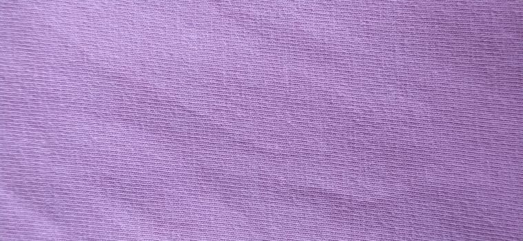 Crumpled pink cotton fabric. Close-up. Fabric texture.