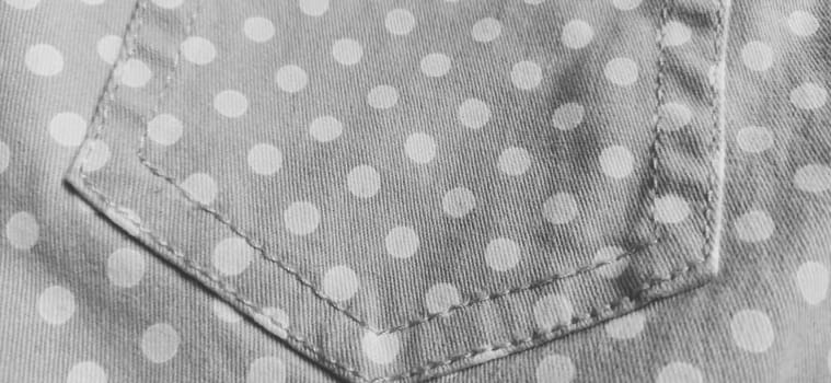 Belgrade, Serbia, 11 September 2020 Trouser pocket. Denim cloth with white circles. Pockets on denim. Polka dot fabric. Black and white monochrome image.