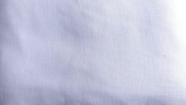 Iron-smoothed white cotton fabric. White background. Tablecloth or sheet