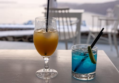 Two cocktails waiting to be drunk during sunset in Santorini