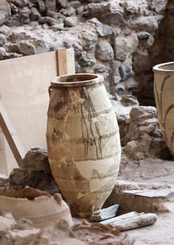 Santorini, Greece - July 01, 2021: Recovered ancient pottery in prehistoric town of Akrotiri, excavation site of a Minoan Bronze Age settlement on the Greek island of Santorini