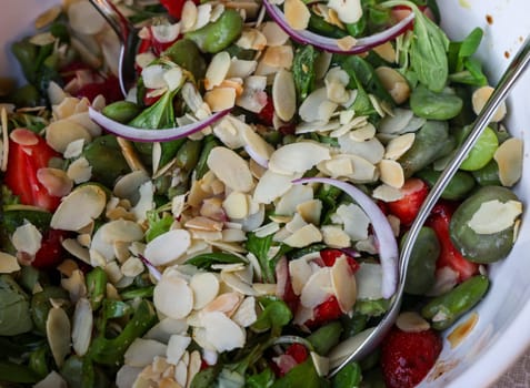 salad with strawberries and broad beans. Delicious dish in a healthy style