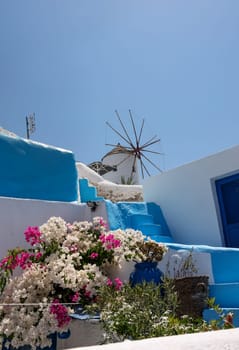 Traditional white windmill in Oia on the island of Santorini. Cyclades, Greece