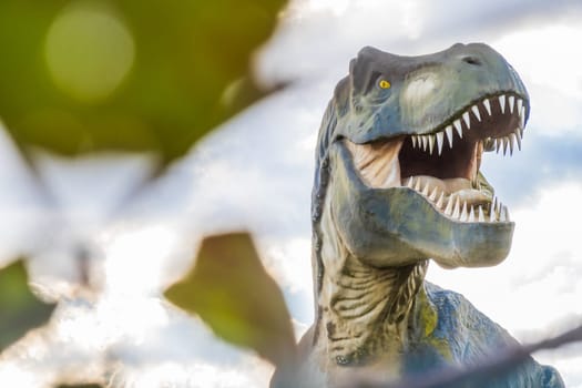 Scary Tyrannosaurus Rex or T-Rex cretaceous dinosaur, photography  with a blurry foreground