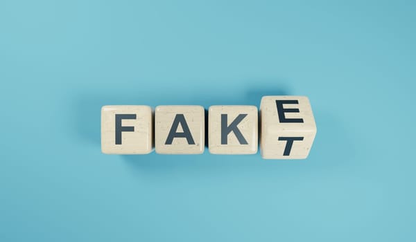 German fake or fact concept with businessman hand turning wooden blocks, 3d rendering