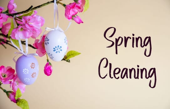 Beautiful Easter Egg Decoration With Spring Flowers. English Text Spring Cleaning. Seasonal Easter Holiday Greeting Card.