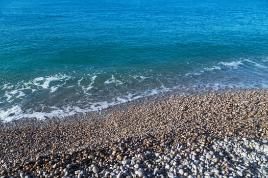 French coastline of Normandy in Etretat, France with pebbles beaches, part of the typical landscape