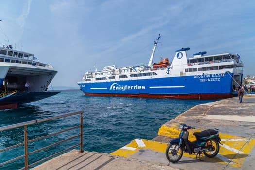 Pireas Greece: May 07 2022: Ferry boats cruise ships docking at the port of Piraeus Greece. The port of Piraeus is the largest passenger port in Europe and the third largest in the world.