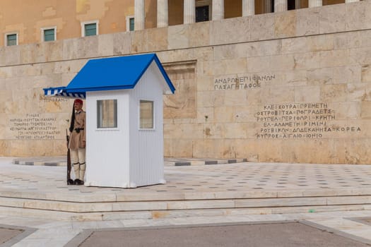 ATHENS, GREECE - MAY 06 2022: Presidential ceremonial guards - Evzones at the Tomb of the Unknown Soldier in front of the Greek Parliament, Athens, Greece