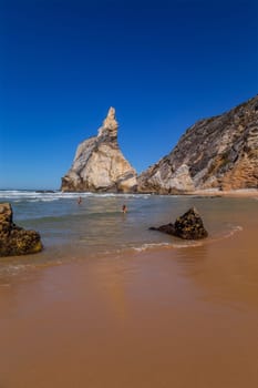 Sintra, Portugal: 22 October 2022 - Praia da Ursa (Ursa Beach) with people, in Sintra near Lisbon in Portugal.