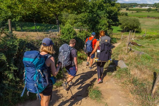 Navarre, Spain, 26 August, 2022: Pilgrims walk along the Camino De Santiago, the Way of St. James pilgrimage route, Navarra, Spain.