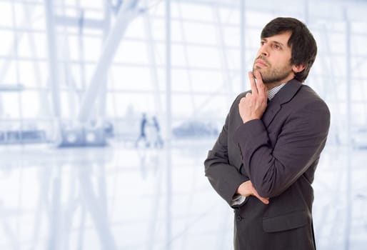young business man thinking, at the office