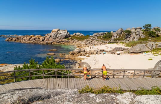 Galicia, Spain - July 27, 2022: People in Galicia beach in a summer day, Galicia. Spain