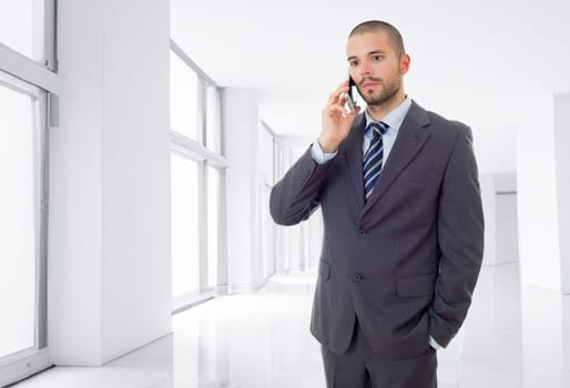 worried business man on the phone, at the office