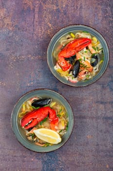 Fresh soup with lobster, mussels, shellfish and fish. Seafood soup. Copy space