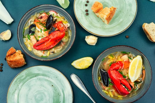 Fresh soup with lobster, mussels, shellfish and fish. Seafood soup. Copy space